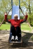 File:Old woman gets her jollies in playground.jpg
