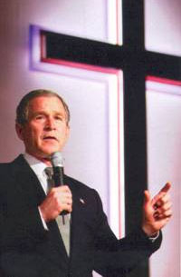 File:Bush in front of cross.jpg