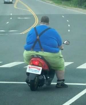 File:Fat man on scooter.jpg