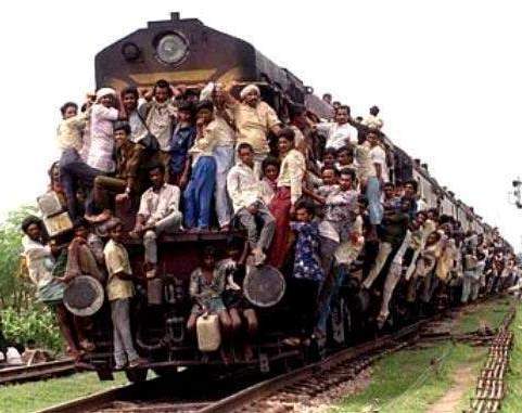 File:Overloaded train hanging india.jpg