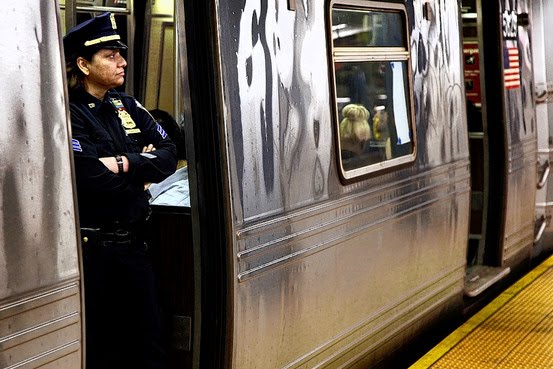File:Police officer aboard subway train.jpg