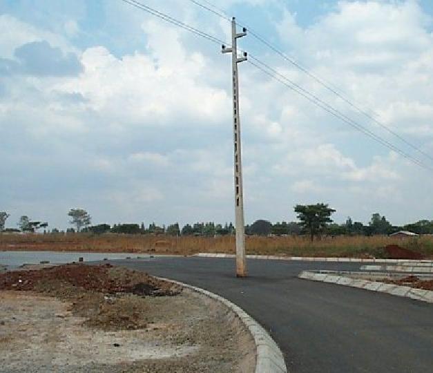File:Power pole in middle of road2.jpg