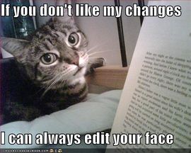 File:Funny-pictures-cat-threatens-to-edit-your-face.jpg