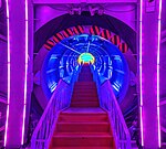 Stairs lit with colorful neon lights inside a corridor of the Atomium in Brussels Belgium.jpg