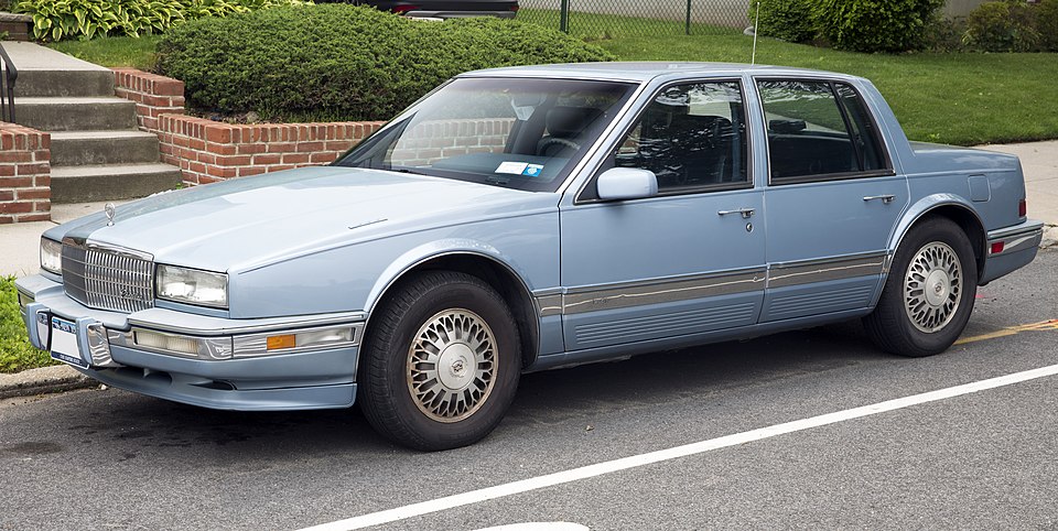 File:1990 Cadillac Seville, front left (Bellerose Manor).jpg
