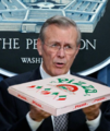 Donald Rumsfeld holding a pizza (Fireworks)