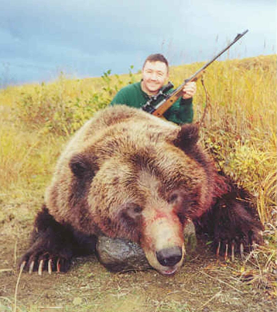 File:Bear hunter with bear.jpg