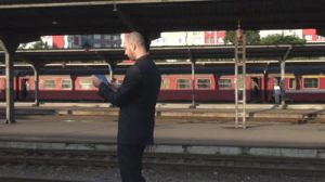 Look at this cunt checking his email on a train platform.