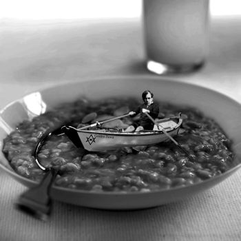 Aleister Crowley rowing his boat "Golden Dawn" in a plate full of porridge
