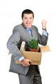 6338071-you-are-fired-young-happy-businessman-hold-cardboardbox-with-personal-belongings-isolated-on-white-b.jpg
