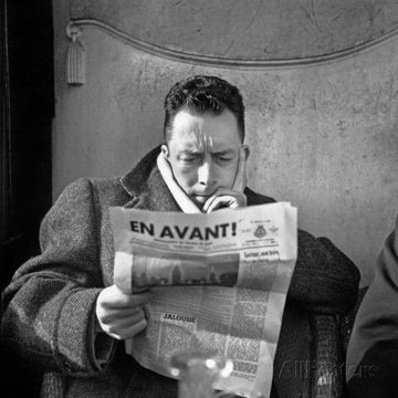 Archivo:Camus leyendo.jpg