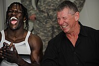 Ron Killings & Vince McMahon laughing.jpg