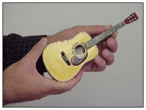 File:Mini guitar hands.jpg