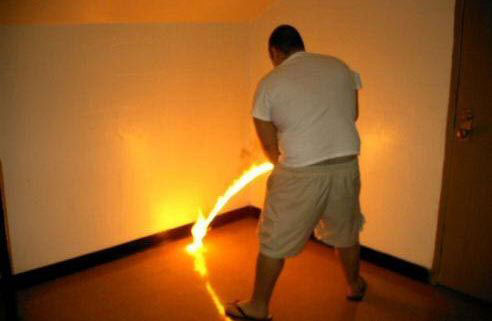 File:Man urinates fire.jpg