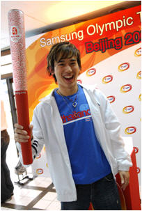 File:Champ with Olympic Torch.jpg