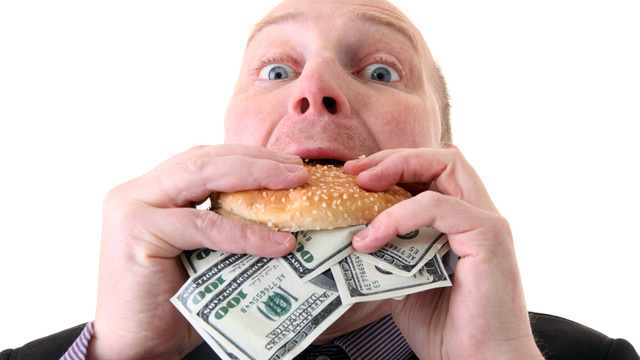 File:Eating money.jpg