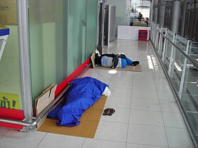 File:Workers taking a nap at Suvarnabhumi Airport.JPG