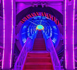 Stairs lit with colorful neon lights inside a corridor of the Atomium in Brussels Belgium.jpg