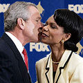 Presenter Condileeza Rice congratulates President Bush as he wins for The Iraq War.