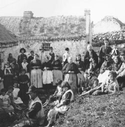 A family gadered outside their fla in Ballymun