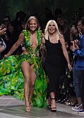 Two random-ass people flexing in Versace