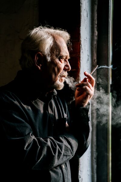 File:Man-smoking-dramatically-pexels-ivan-samkov-min.jpg