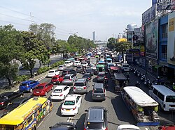 A traffic jam on Marcos Highway in Singapore, which has nothing to do with Robert Moses.
