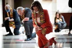 Pelosi kneeling.jpg