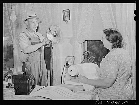 File:Knox County, Tennessee (Tennessee Valley Authority (TVA)). Mr. Bacon adjusts an electric fan for his wife who is using an electric iron. The Bacons use 500 kilowatt hours of TVA electricity a month LCCN2017832582.tif