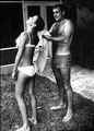 Connery, assh Jamesh Bond, asshaulting a woman with a towel.