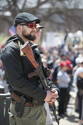 Man with with fire arms at Gun rights rally at the Minnesota State Capitol.jpg