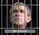 Bush-jail bars-war criminal.jpg