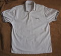 A white polo shirt is associated with the word "awful." It is put on by a person who is having an awful day. The person does not feel like dressing up, and they care the least about what they are wearing.